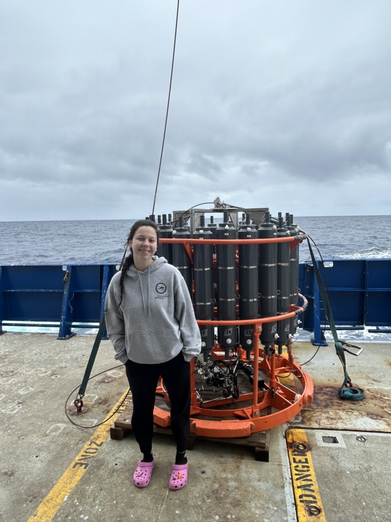 Madeleine Thompson standing in front of the CTD rosette