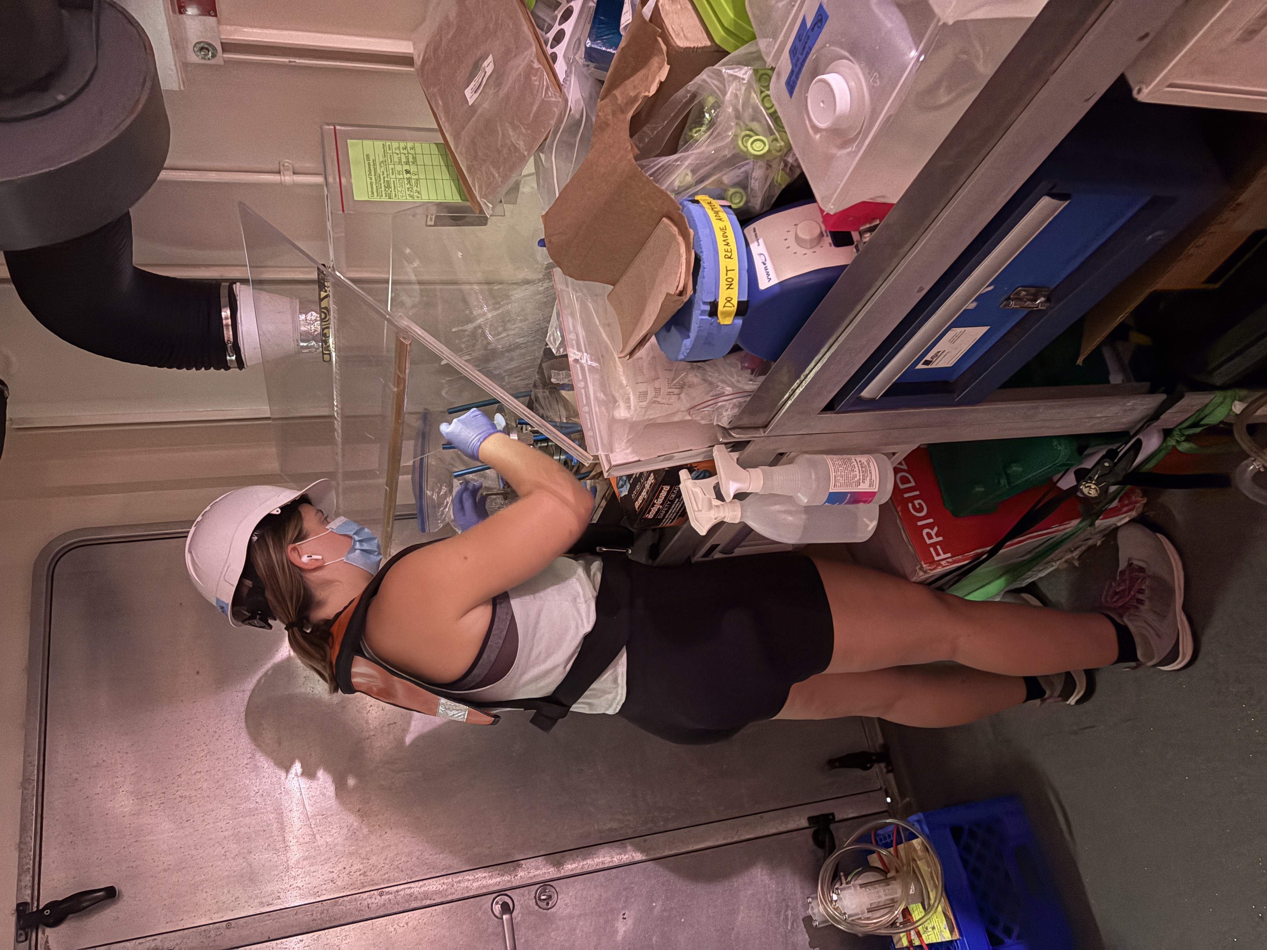 Jordan processing a filter in the shared-use lab van aboard R/V Savannah