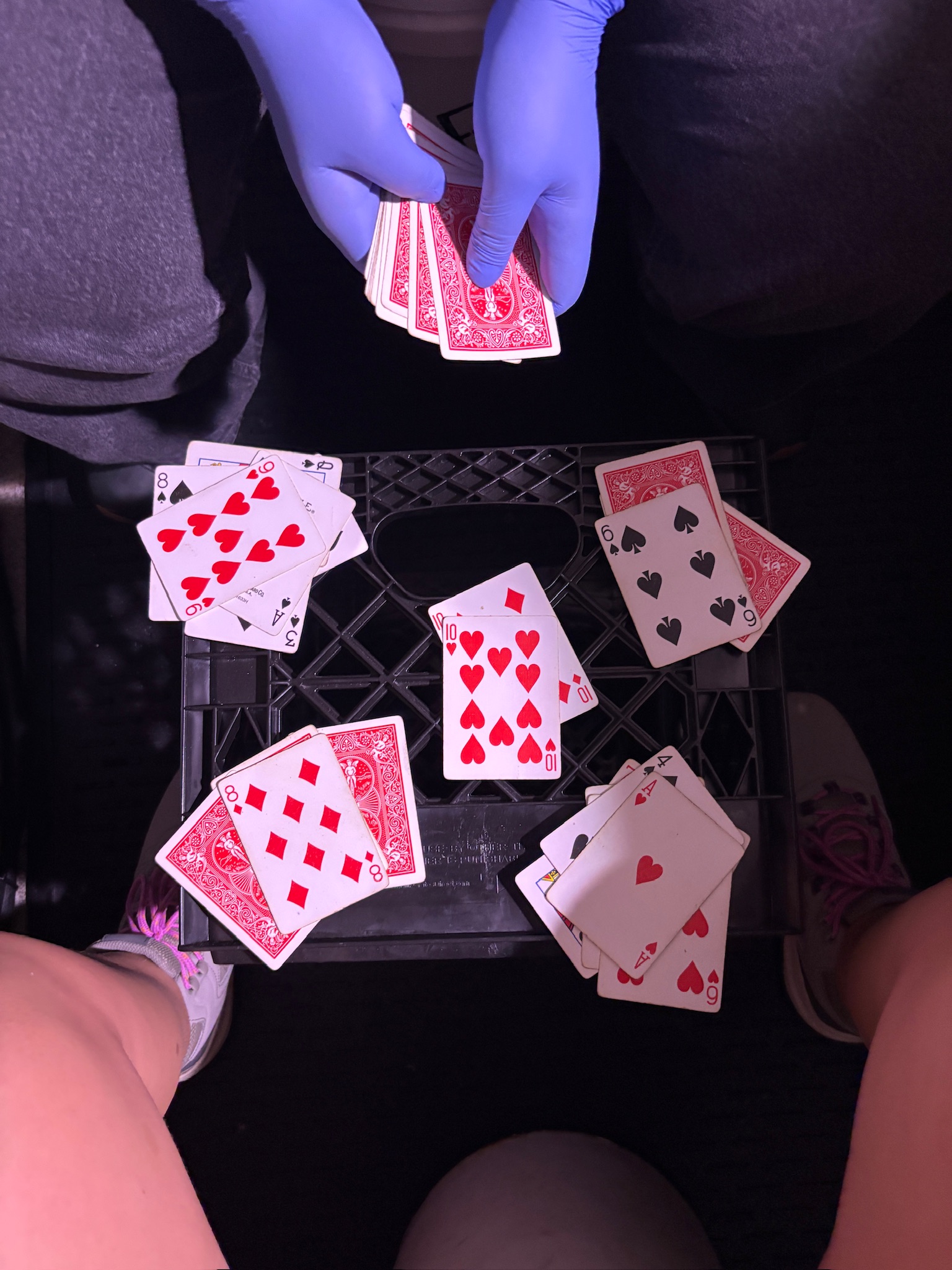 A late-night card game of War during overnight filtration work